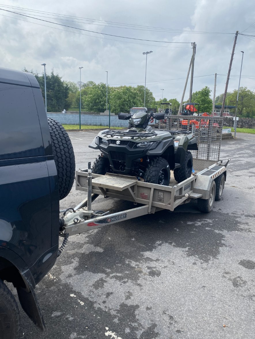 Suzuki ATV loaded on our trailer for delivery