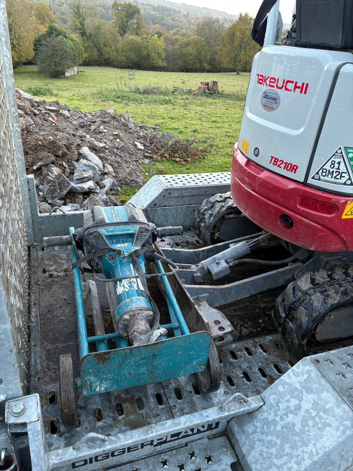 Makita hand-held breaker loaded with a Takeuchi TB210R
