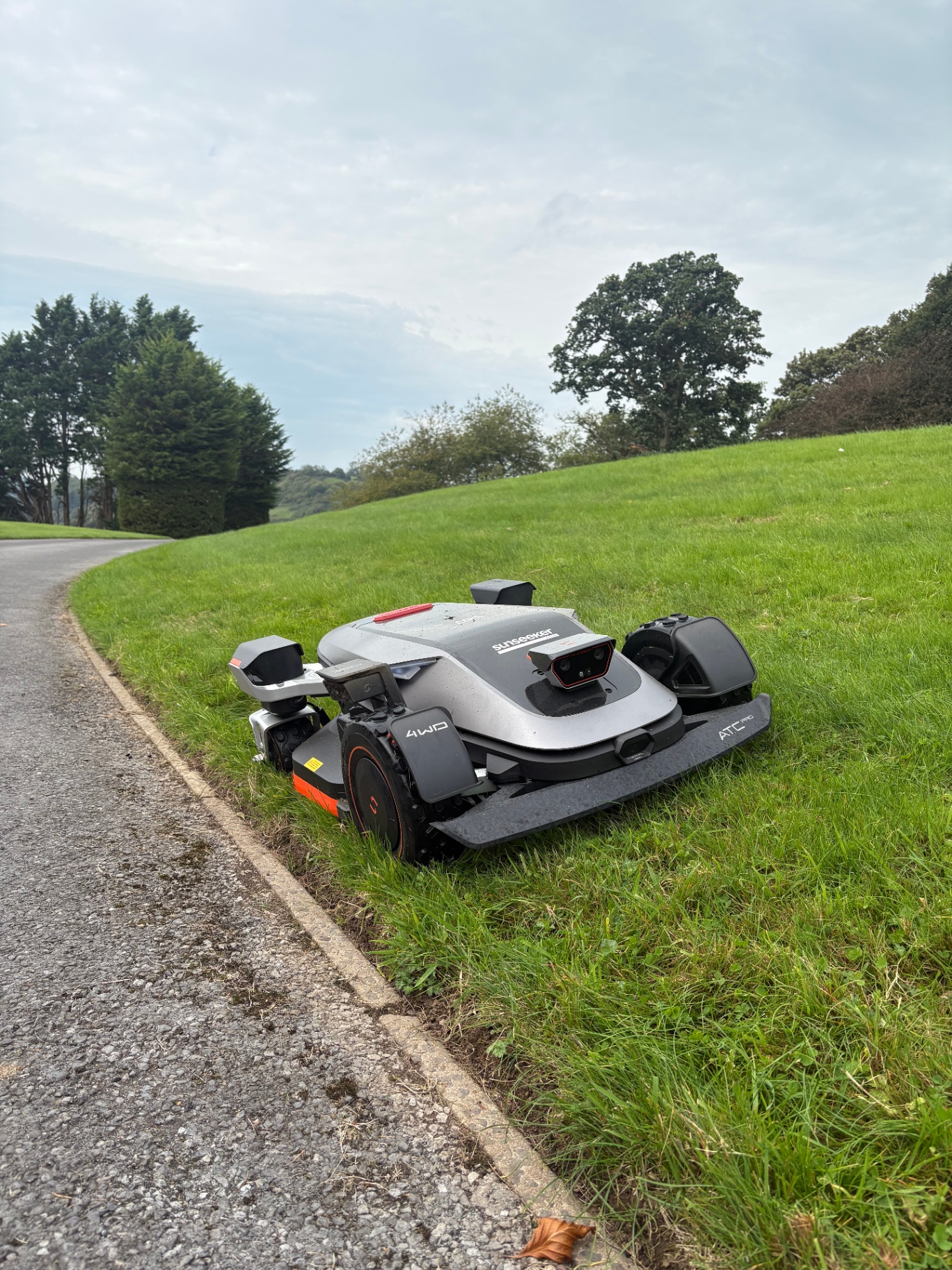 Sunseeker 4WD robot mower at work on a lawn