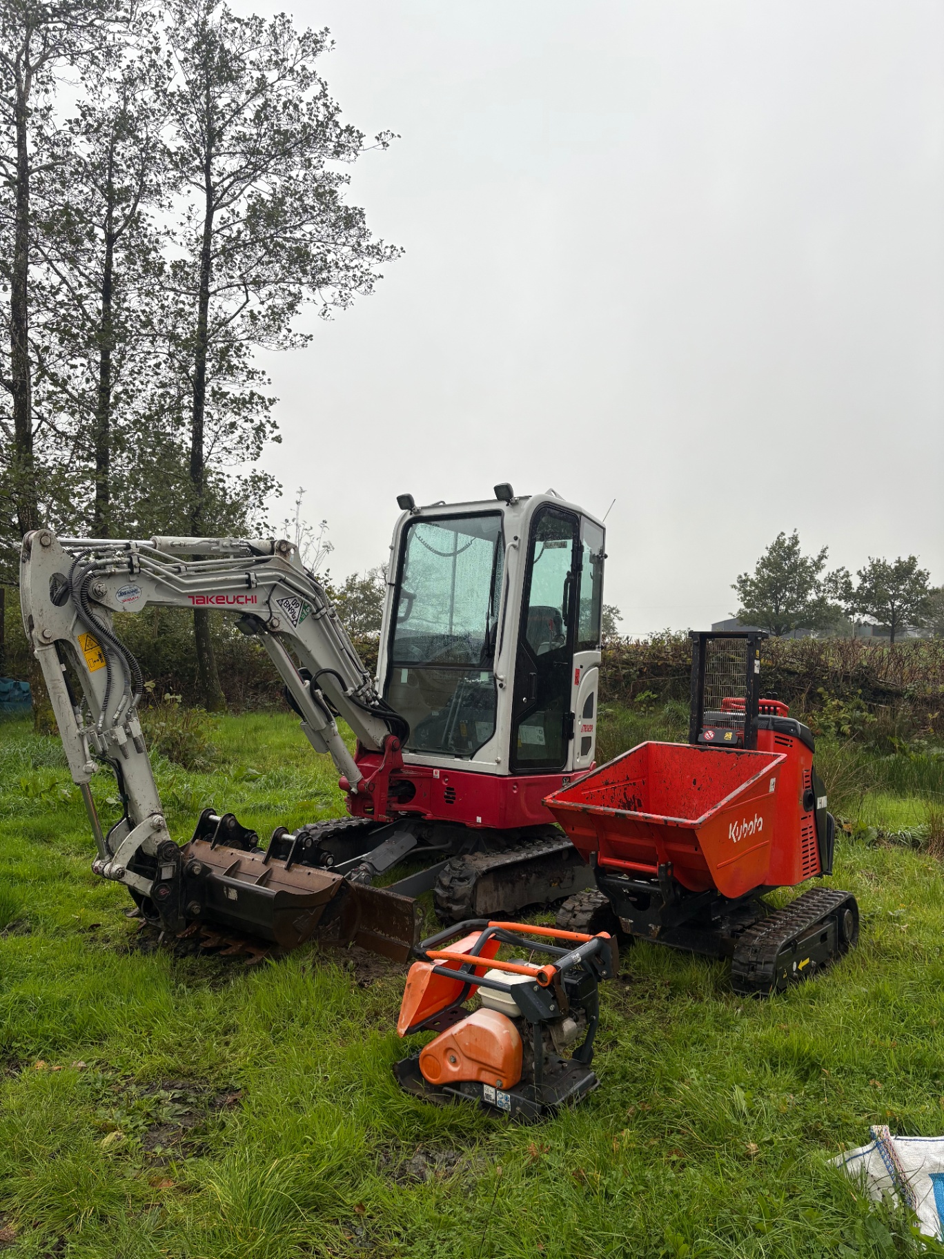 Takeuchi digger and Kubota tracked dumper working on site