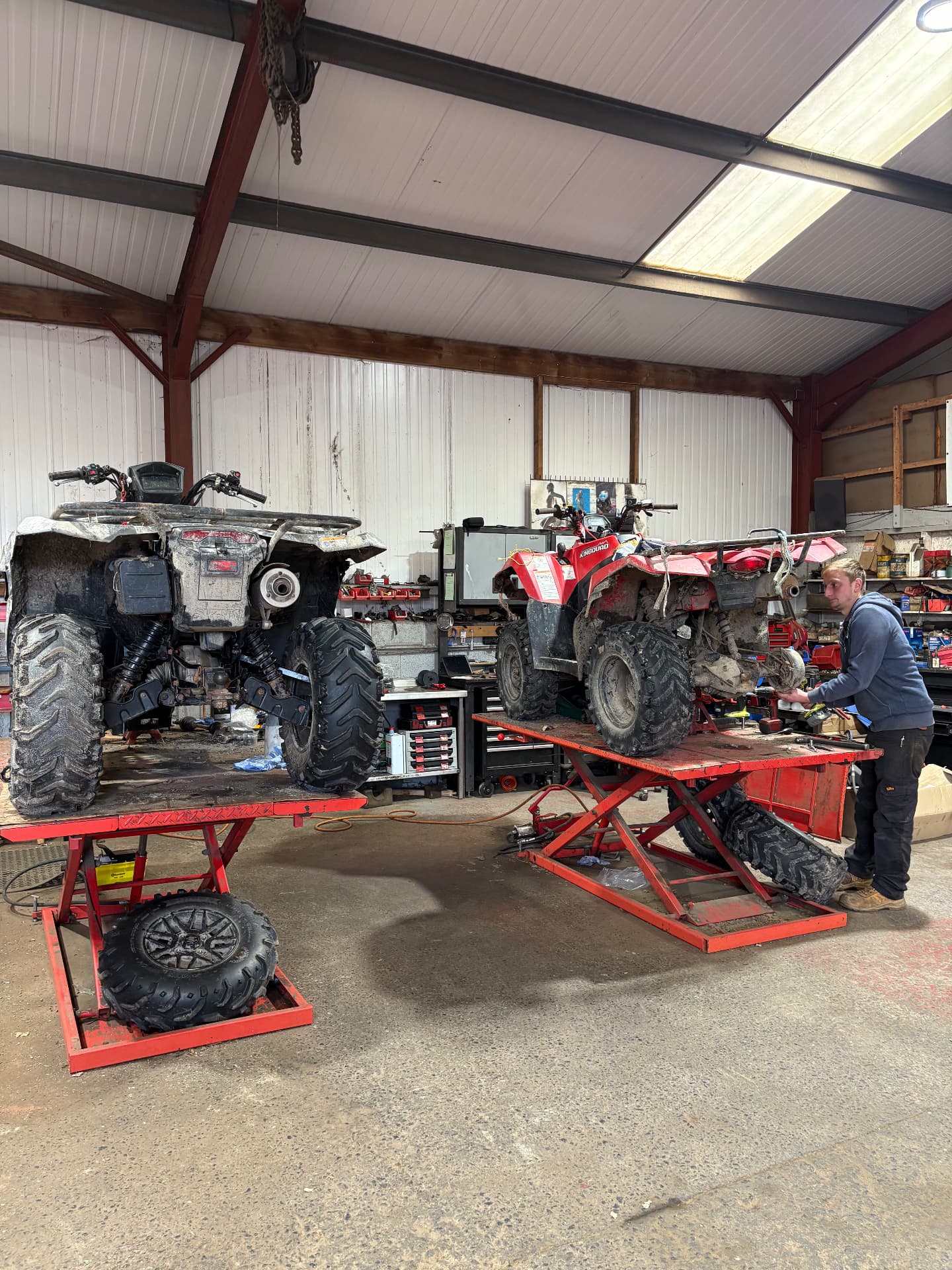 One of our mechanics working on an ATV on the ramp