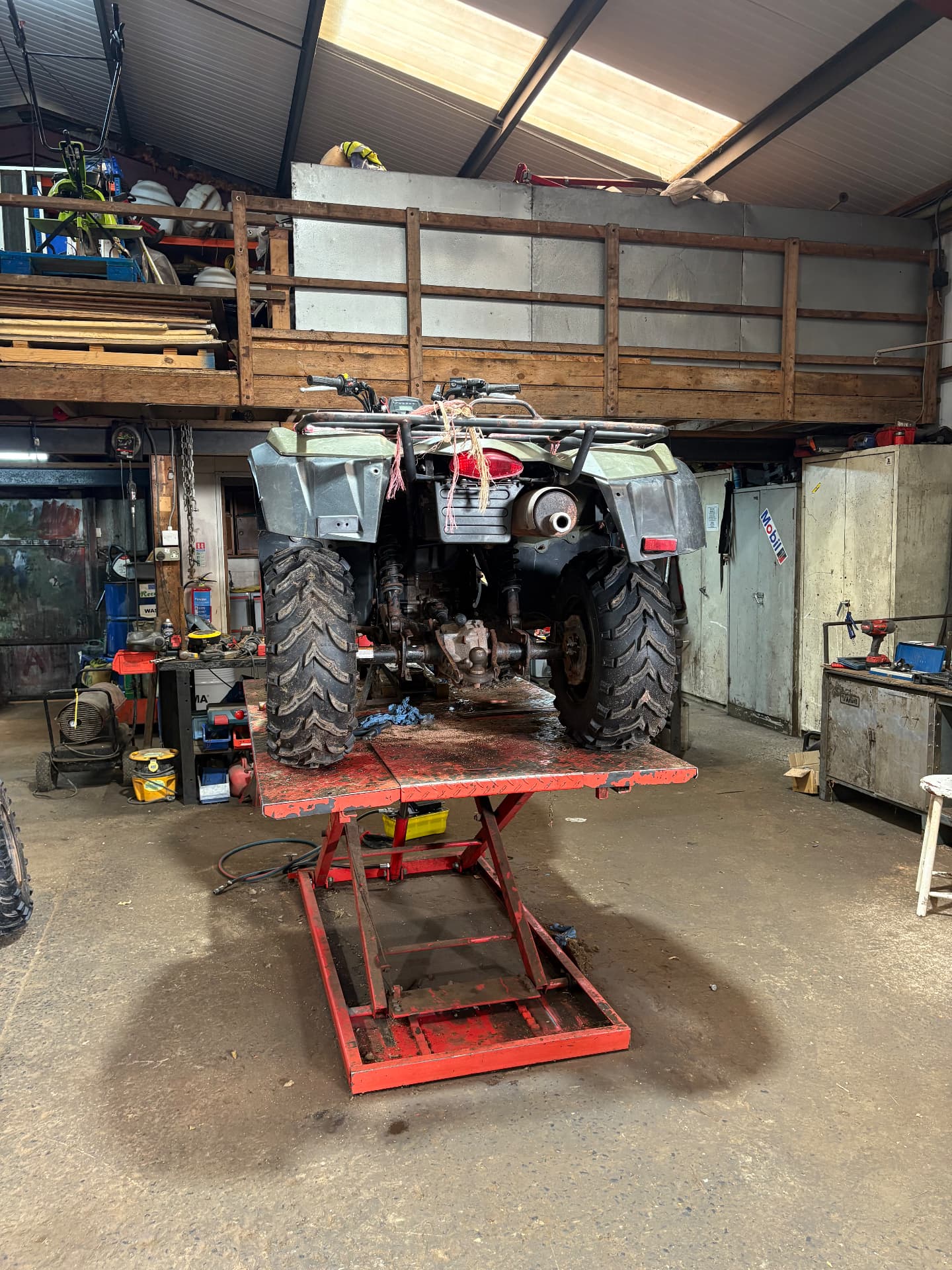 An ATV up on the ramp in our workshop