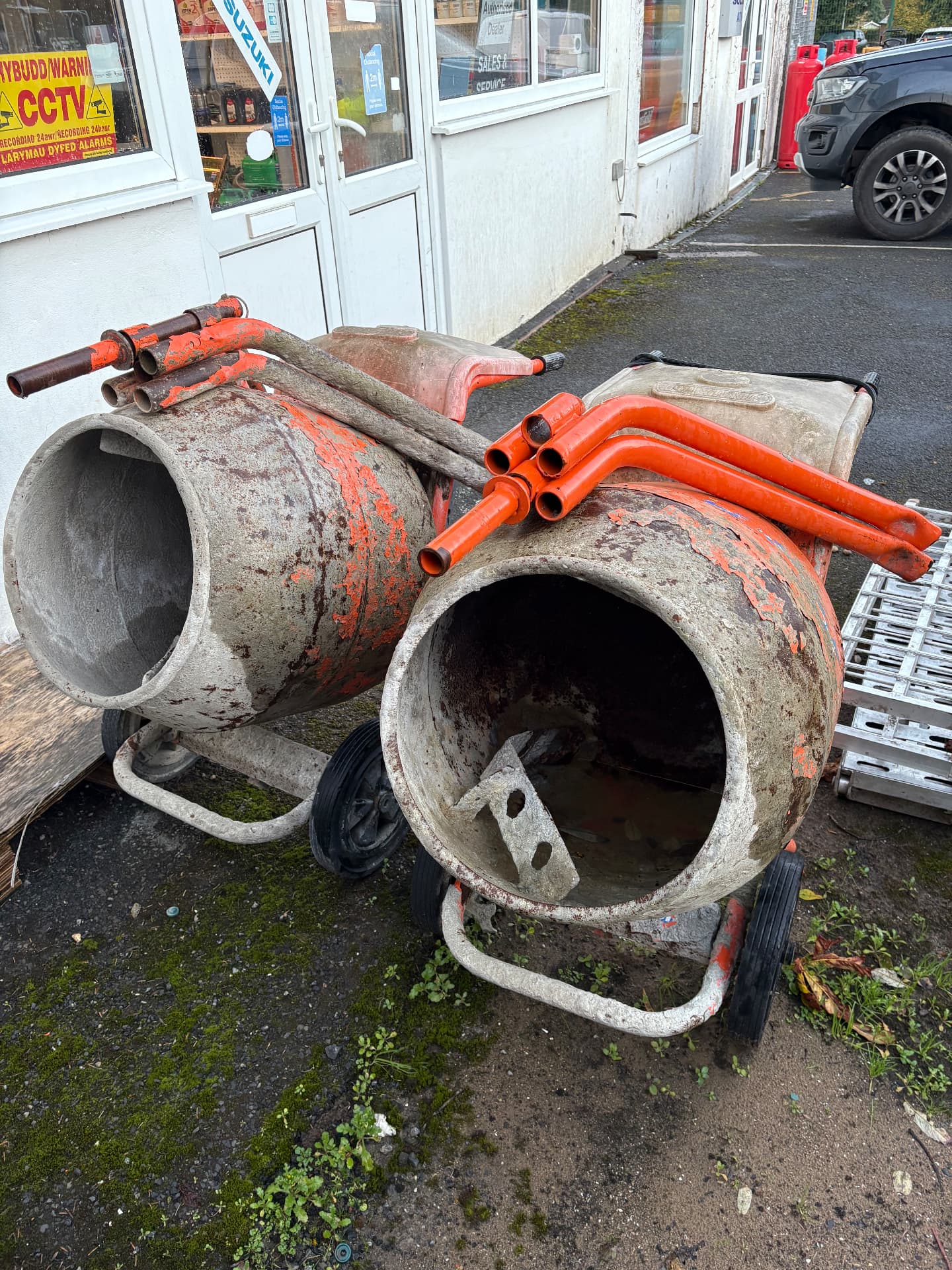 Two cement mixers outside our shop