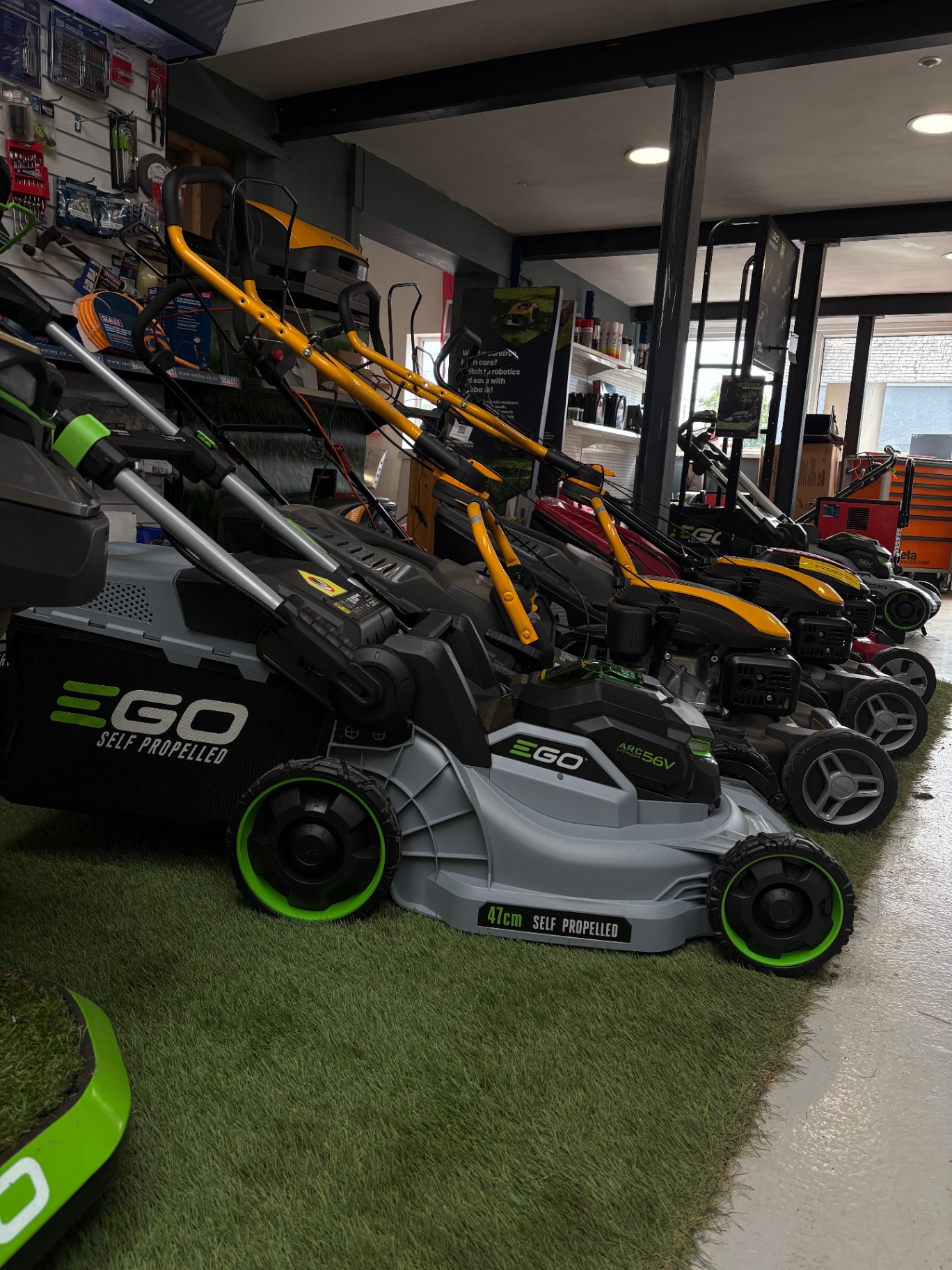 Row of EGO self-propelled mowers in our showroom