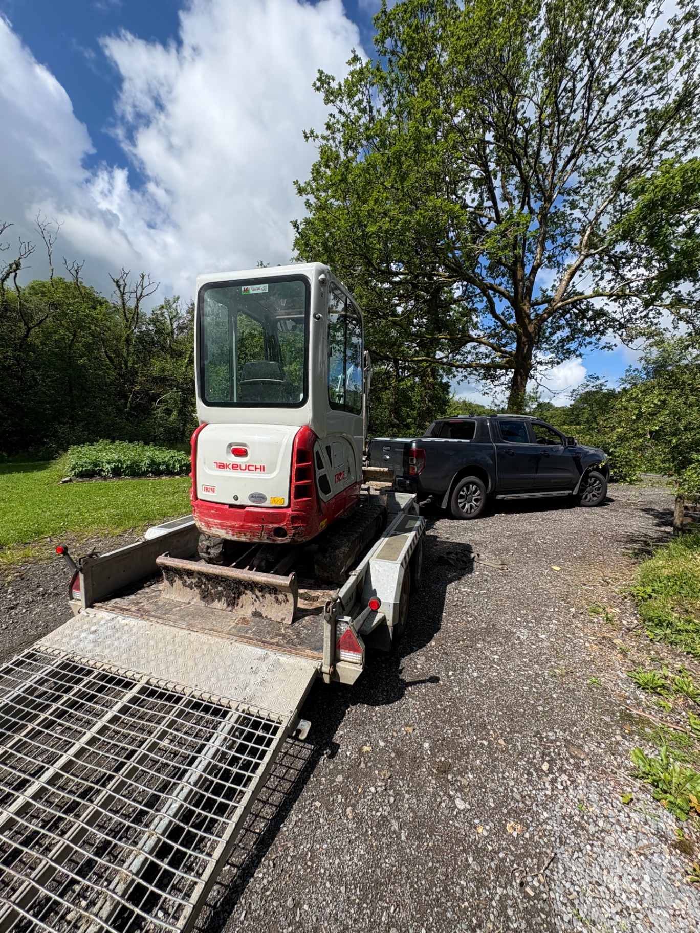 Takeuchi TB216 mini digger on our trailer behind the pickup