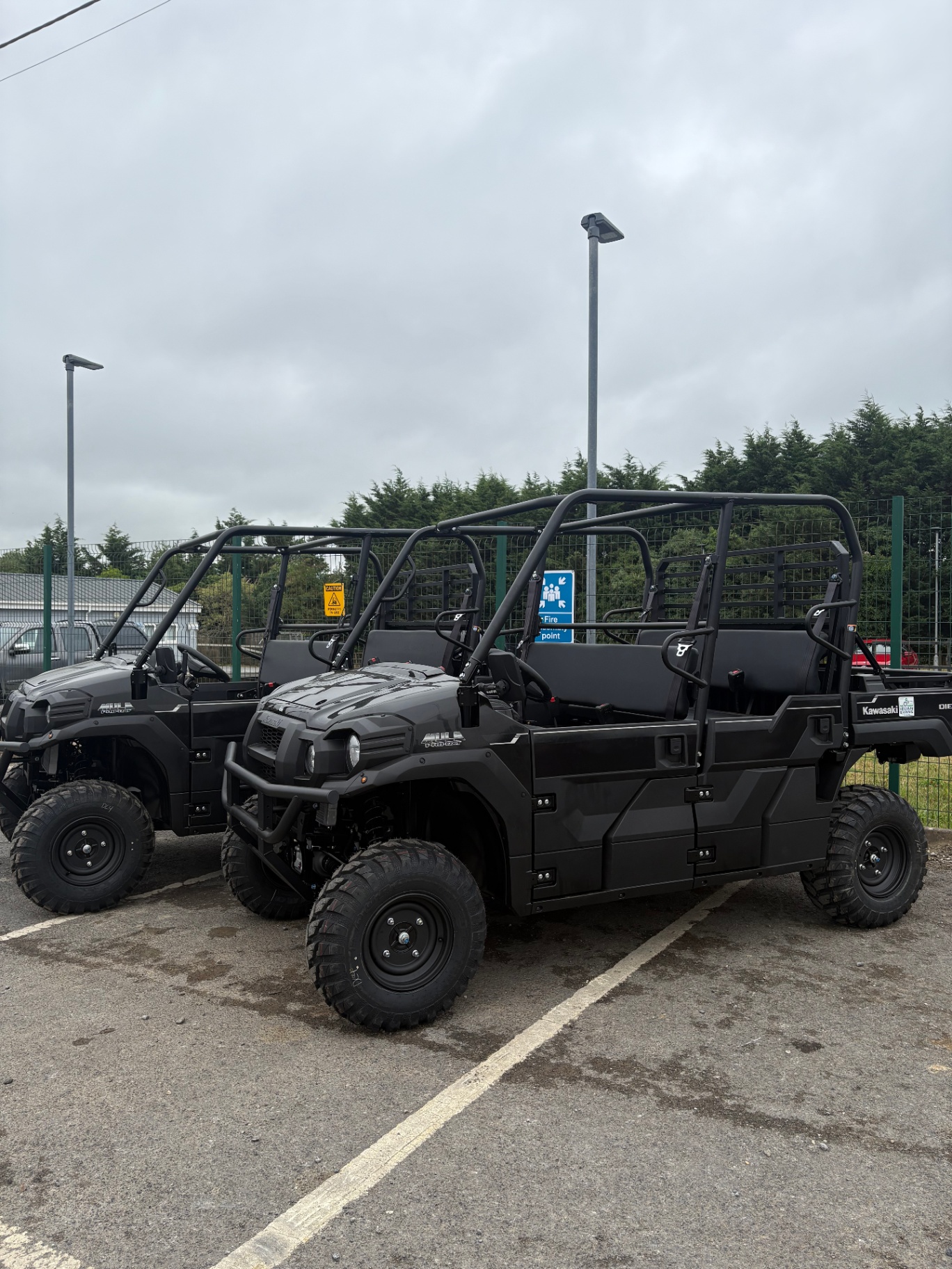 Two Kawasaki Mule PRO-DXT UTVs in our yard