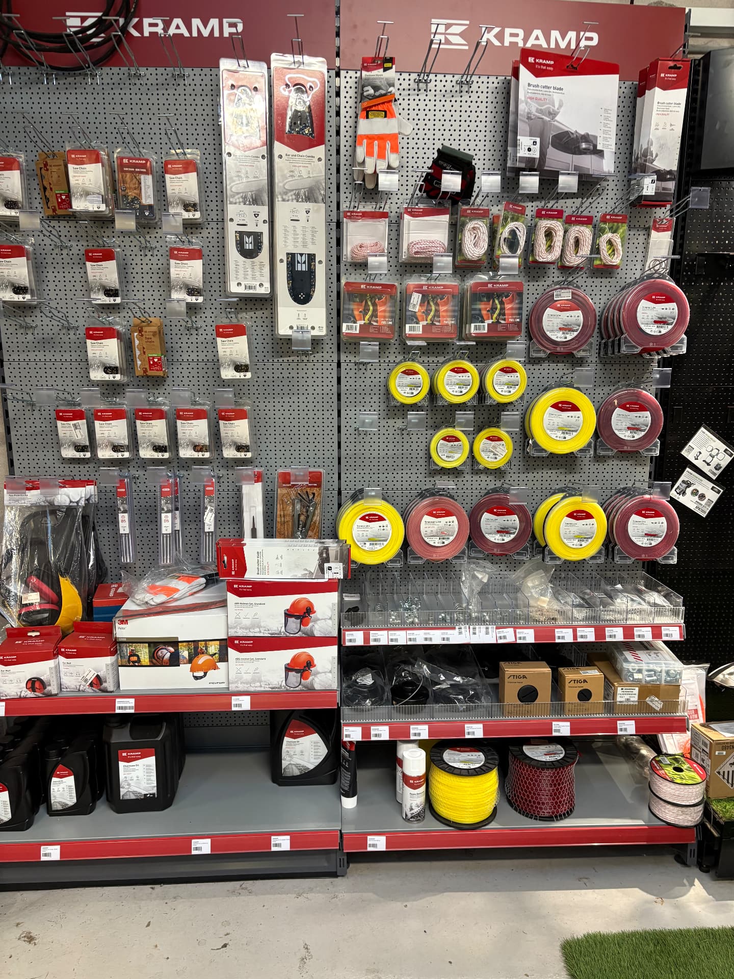 Kramp parts wall in our shop with saw chains, strimmer line and safety gear
