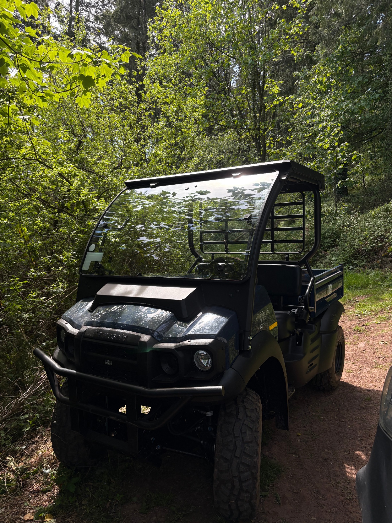 Kawasaki Mule UTV on a woodland track